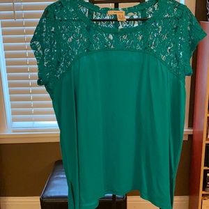 This is a teal DKNY JEANS dressy T-shirt